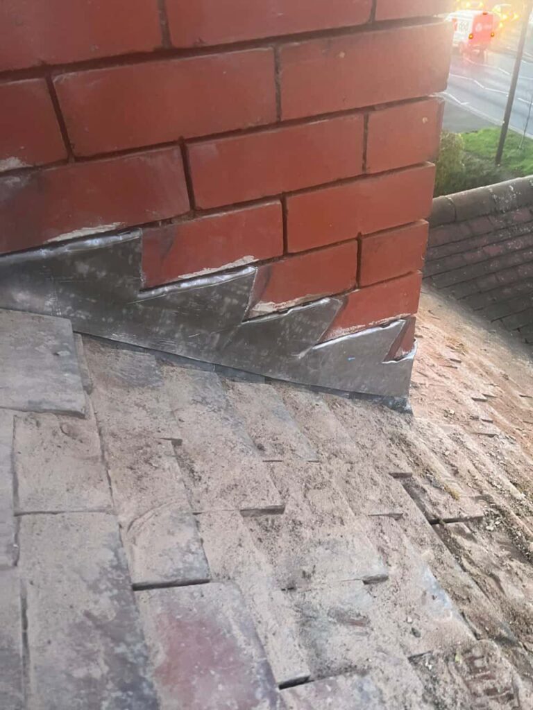 This is a photo of new leadwork being installed around an old chimney. Works carried out by Kidderminster Roofing Repairs